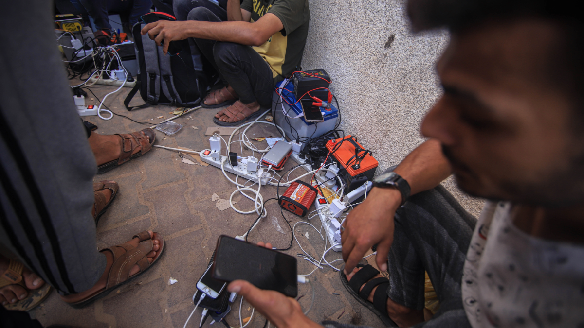 Palestinians charge phones in Gaza